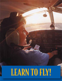 A woman piloting an aircraft "Learn to Fly" is written below
