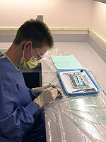 hygienist preparing a cleaning toolkit