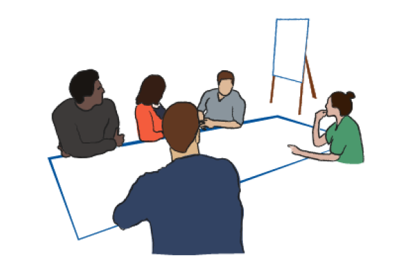 Diverse faculty discuss ideas at a table with a whiteboard in the background