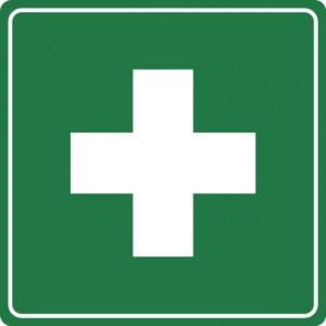 a pictogram showing a white cross on a green background indivating first aid supplies