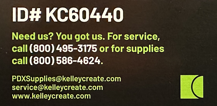 Printer sticker, showing an ID followed by phone numbers to call