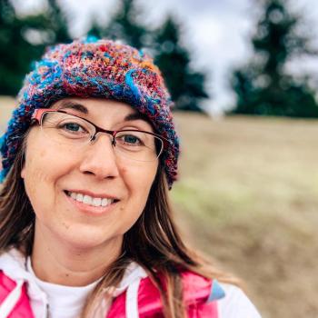 Employee Wellness Coordinator Jenni Miner hiking in the Oregon wilderness